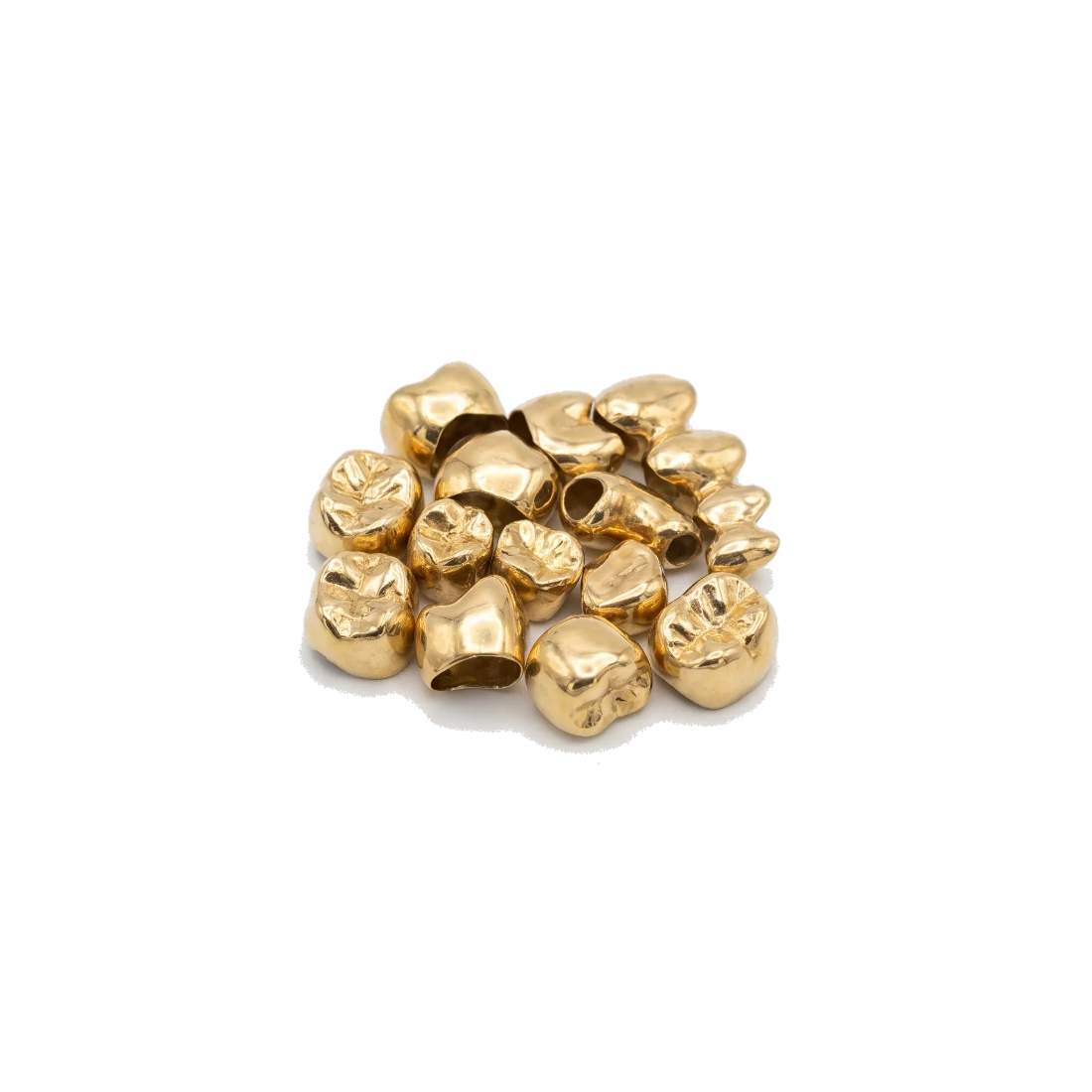 A small heap of yellow gold dental crowns.